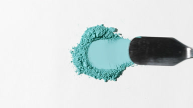 Cyan Powder Heap Dragged on Light Gray Background