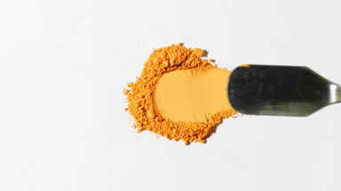 Yellow Powder Scraped on Light Grey Surface