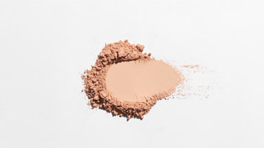 Beige Powder Heap with Dynamic Shadows for Foundation Ad