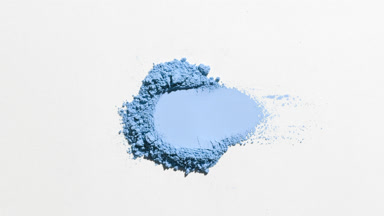 Blue Powder Heap with Dynamic Shadows on Light Gray