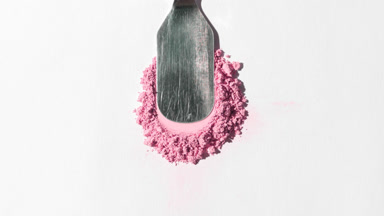 Pink Loose Powder Spread on Light Gray Backdrop
