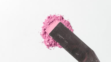 Pink Powder Heap Smeared on Light Gray Canvas