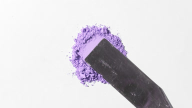 Violet Loose Powder Spread on Light Grey Background