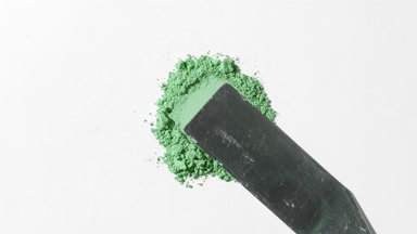 Green Loose Powder Streaked on Light Gray Backdrop