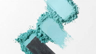 Cyan Shades Powder Heaps on Light Gray Surface