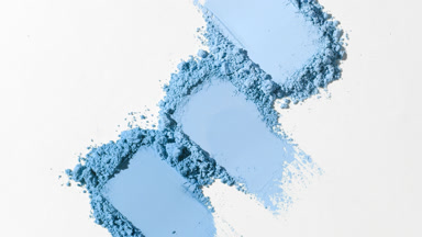 Three Blue Powder Smears with Dynamic Lighting on Soft Gray