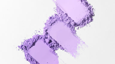 High-Magnification Violet Powder Smears on Pale Gray Canvas
