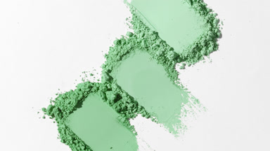 Close-Up of Linear Green Powder Smears on Muted Grey Background