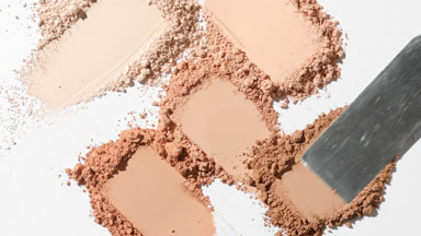 Macro Close-Up of Chaotic Beige Powder Smears for Foundation