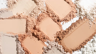 Detailed Close-Up of Beige Powder Smears for Foundation Ad