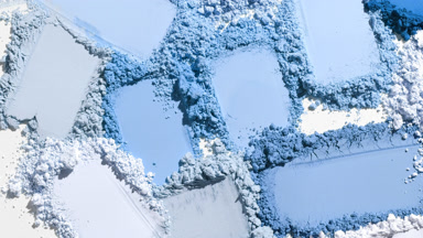 Vivid Blue Powder Smears on Light Grey Background