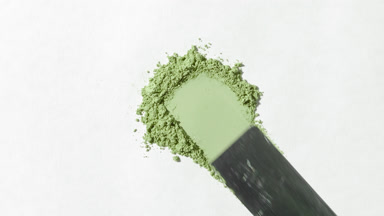 Pale Green Powder Smoothed on Light Grey Surface