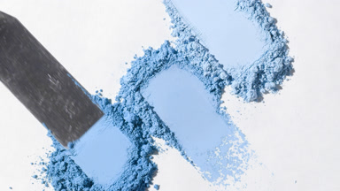 High-Magnification Close-Up of Blue Powder on Gray