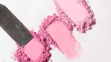 Close-Up of Pink Powder Heaps on Light Grey Backdrop