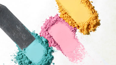 Detailed Close-Up of Yellow, Pink, and Cyan Powder for Eyeshadow