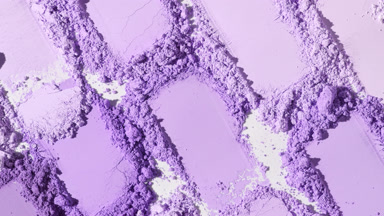Tight Close-Up of Violet Powder Heaps with Shadows