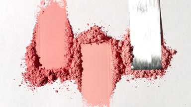 Red Powder Smears on Soft Grey Base for Blush Marketing