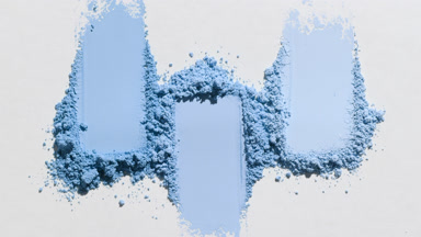 Organized Blue Powder Streaks on Subtle Grey Surface