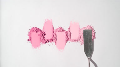 Pink Powder Heaps for Blush Ad on Gentle Grey Surface