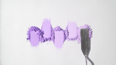 Violet Powder Heaps Arrangement on Faint Grey Backdrop