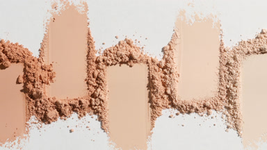 Beige Loose Powder Streaks on Light Grey Background