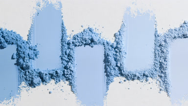 Detailed Blue Powder Smears on Light Gray Surface