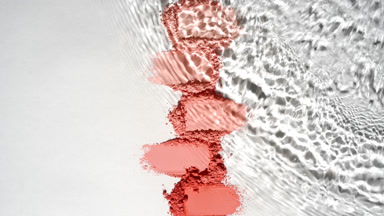 Slow-Motion Water Over Red Powder Heaps