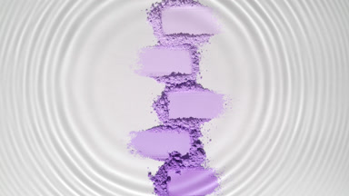Water Droplet Creating Circles Over Violet Powder Heaps