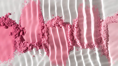 Slow Motion Water Flow Over Pink Powder Heaps