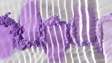Extreme Close-Up of Water on Violet Powder Heaps