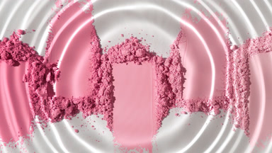 Droplet Producing Ripples on Pink Powder Heaps
