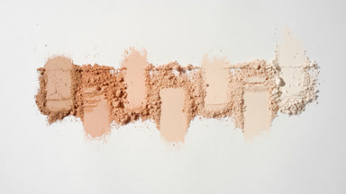 The thread interacts dynamically with the loose powder