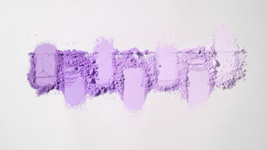 A visually striking display of vibrant violet powder textures