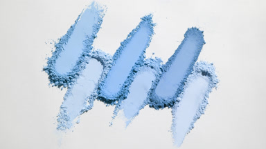 Fluid Blue Powder Smears on Gentle Grey Surface