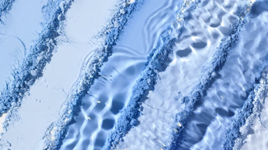 Dynamic Water Splash Over Blue Palette Knife Surface