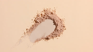 Beige Powder Pile on Beige Background with Dynamic Lighting