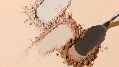 Close-Up of Three Beige Powder Heaps for Foundation Campaign