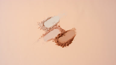 Slow-Motion Beige Powder on Tan Background