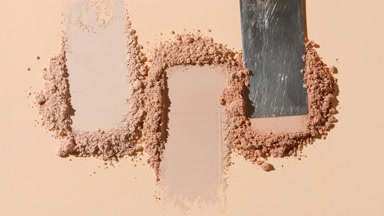 Close-Up of Beige Powder Heaps on Beige Background