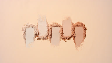 Illuminated Beige Powder Piles with Moving Shadows
