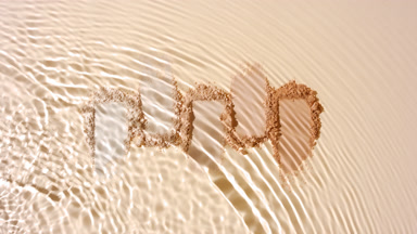 Slow Motion Water Stream Over Beige Powder Smears