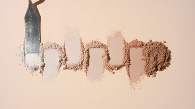 Row of Beige to Brown Powder Heaps with Palette Knife
