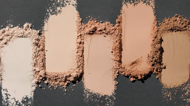 Close-Up of Beige Powder Smears with Rotating Light Effects