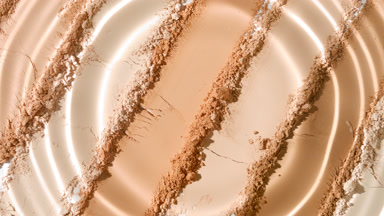 Macro Shot of Water Droplet on Beige Powder Surface