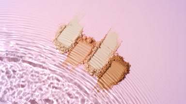 Water Splashing on Beige to Brown Powder Streaks
