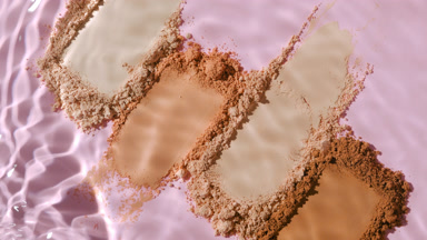 Slow Motion Water Splash on Beige to Brown Powder Smears