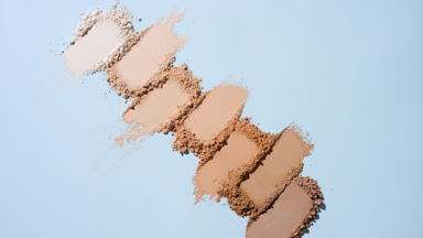Aerial View of Beige to Brown Powder Streaks on Blue Surface