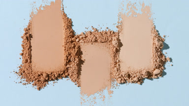 Close-Up of Ordered Skintone Powder on Light Blue Backdrop