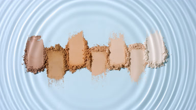 Water Droplet Circles Over Seven Skin Tone Powder Heaps