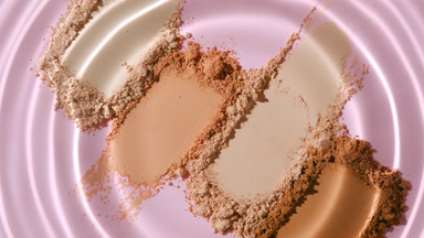 Water Droplet Making Concentric Circles on Skin Tone Powders